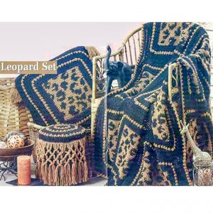 May include: A leopard print set including a blanket, pillow, and ottoman. The set features a navy blue and tan color scheme. The ottoman has a macrame design with fringe. The text "Leopard Set" is visible.