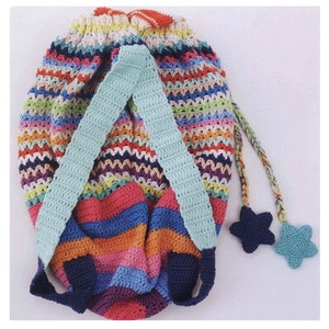 May include: A colorful crocheted backpack with blue straps and two star-shaped charms. The backpack is made with a variety of colors, including red, orange, yellow, green, blue, purple, and pink.