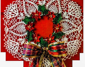 May include: White crocheted doily with a red and green poinsettia wreath and a plaid bow.