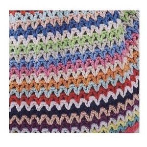 May include: Multicolored crochet blanket with a chevron pattern. The blanket is made with a variety of colors, including pink, blue, green, yellow, orange, and red.