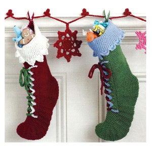 May include: Two crocheted Christmas stockings, one red and one green, with white and green laces, hanging from a red and white garland with crocheted snowflakes.