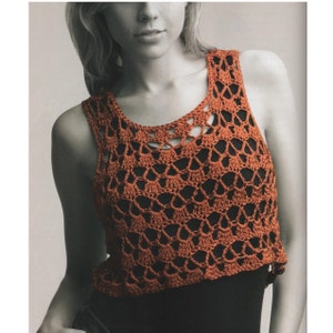May include: A crocheted tank top with a lacy pattern in a burnt orange color.