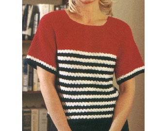 May include: A red, white, and black striped crochet top with short sleeves. The top has a red band at the top and a black band at the bottom.
