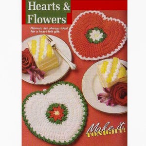 May include: A page from a craft magazine featuring crochet heart-shaped trivets in red and white with green trim. The text "Hearts & Flowers" is at the top, with "Make it TONIGHT!" at the bottom. Slices of cake and roses are also shown.