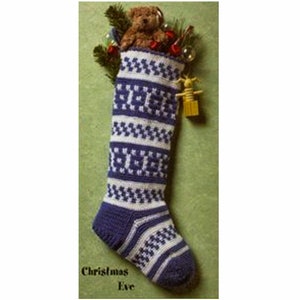 May include: A blue and white crocheted Christmas stocking with a teddy bear inside. The stocking has a white cuff and a blue toe. The stocking is decorated with a white and blue geometric pattern.