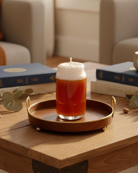 A dead-ringer replica beer can made from soy & gel wax with a frothing head — the double-take is the whole point.