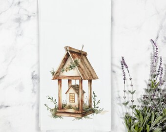 May include: A watercolor illustration of a birdhouse with a small house inside. The birdhouse is made of wood and has a brown roof. The house is white with a brown door and windows. The birdhouse is surrounded by green leaves and vines.