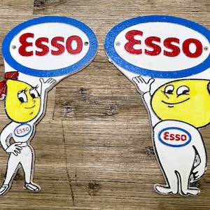 Set of cast iron plates - Esso couple Andy & Abbey Slick -Esso oil