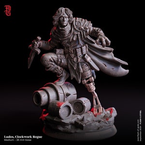 May include: A detailed grey figurine of a character named Ludos, Clockwork Rogue, with a 25 mm base. The figure is in a dynamic pose, holding a dagger, with a mechanical leg and cape. The base includes mechanical parts and rocks.