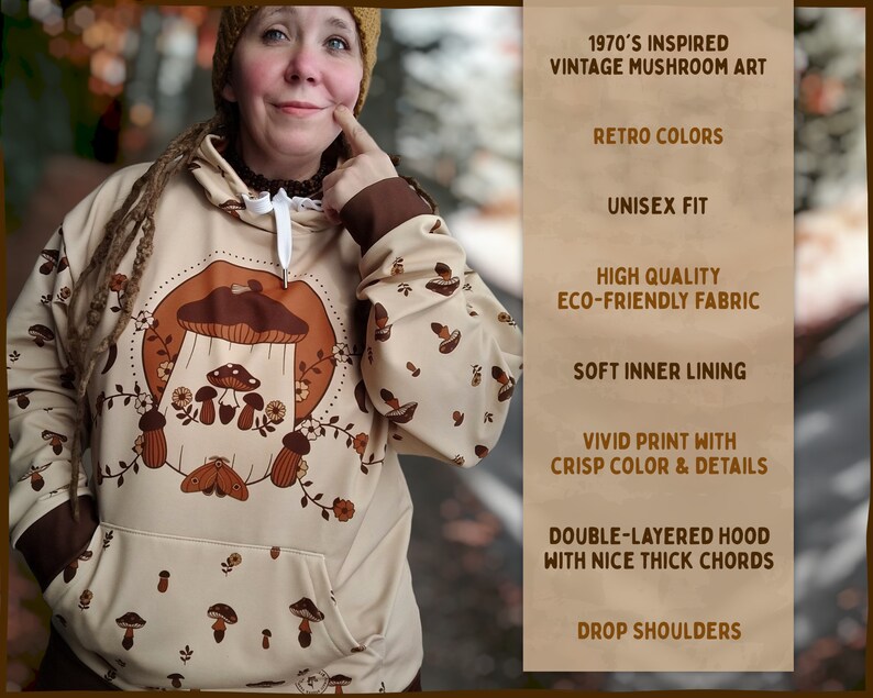 May include: A beige hooded sweatshirt with a vintage mushroom illustration in brown and white. The sweatshirt has a double-layered hood with thick cords, drop shoulders, and a soft inner lining. The text "1970's INSPIRED VINTAGE MUSHROOM ART" is printed on the right side of the image.