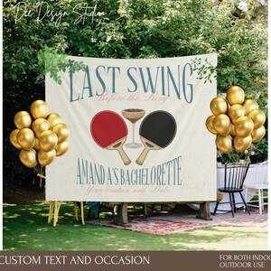 May include: A white banner with the text "Last Swing Before the King" and a graphic of two ping pong paddles. The banner also includes the text "Amanda's Bachelorette" and "Your location and date". The banner is decorated with gold balloons.