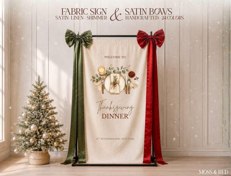 May include: A cream-colored fabric sign hanging on a black metal stand, featuring a printed illustration of a place setting, the text "WELCOME TO Thanksgiving DINNER 14TH NOVEMBER 2016, NEW YORK," and large olive green and deep red satin bows.