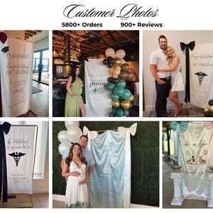 May include: A collection of six vertical fabric banners displayed on metal stands, featuring various custom printed designs, text, and large decorative bows at the top. The banners are used as event backdrops for graduations, baby showers, and gender reveals.