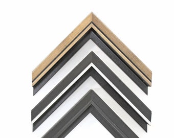 May include: Three picture frames, stacked on top of each other, with a black, white, and wood grain finish.