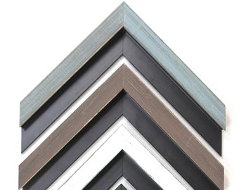 May include: A set of eight picture frames with different colored wood frames. The frames are arranged in a chevron pattern, with the lightest frame at the top and the darkest frame at the bottom. The frames are all made of wood and have a distressed finish.