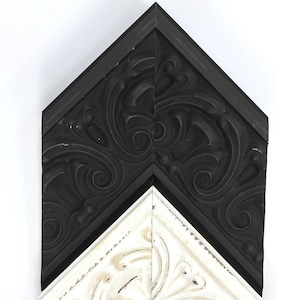 May include: A black and white chevron patterned picture frame with an ornate design. The frame is made of wood and has a distressed finish.