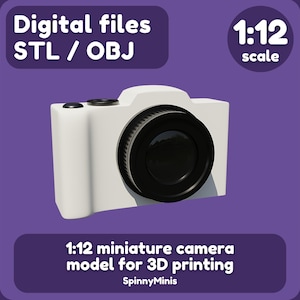 Op de afbeelding: Een wit 1:12 schaalmodel van een miniatuurcamera voor 3D-printen. De digitale bestanden zijn beschikbaar in STL- en OBJ-formaten. Het model is ontworpen voor 3D-printen.