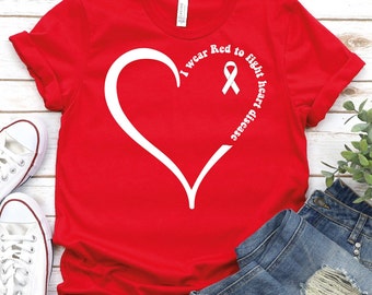 May include: Red t-shirt with a white heart and the text "I wear Red to fight heart disease". A white ribbon is inside the heart.