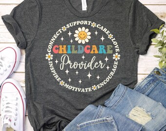 May include: A dark gray t-shirt with a colorful graphic design that says "Childcare Provider" surrounded by the words "Connect, Support, Care, Love, Inspire, Motivate, Encourage".