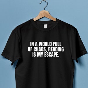 May include: Black t-shirt with white text that reads "In a world full of chaos, reading is my escape."
