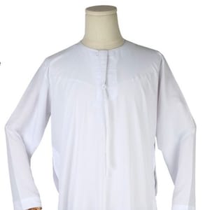 May include: A white long-sleeved shirt with a button-up collar and a zipper closure down the front.