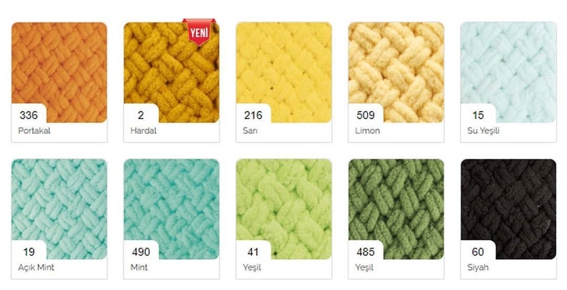 May include: A collection of yarn samples in various colors, including orange, yellow, green, blue, and black. The yarn is arranged in a grid pattern and labeled with numbers and color names in Turkish.