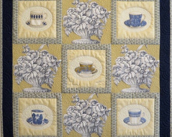 Teacups and Toile, a soft yellow and blue handmade quilted wall hanging perfect to gift for Mother's Day, a birthday, or housewarming.