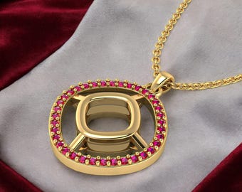 May include: Gold-colored pendant necklace with a square-shaped design. The pendant is adorned with small, round, red gemstones around the outer edge. The necklace chain is also gold-colored, and the pendant is resting on a gray and maroon fabric.