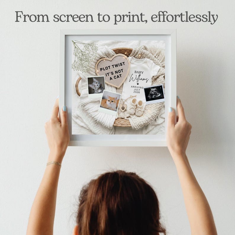 May include: A white square frame containing a pregnancy announcement display with a heart-shaped letter board reading PLOT TWIST IT'S NOT A CAT, a white baby onesie labeled Baby Williams Arriving July 2026, two cat photos, an ultrasound, and baby booties.