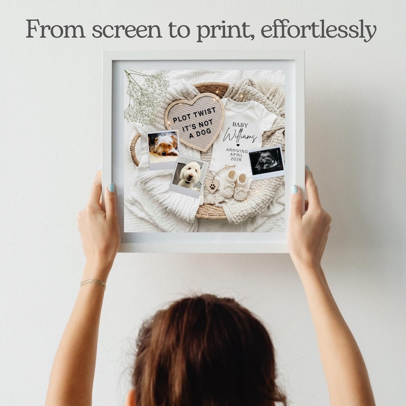 May include: A framed print with a baby announcement theme. The print includes a white onesie, baby shoes, ultrasound image, and photos of dogs. Text on the print reads "Plot Twist It's Not A Dog" and "Baby Williams Arriving April 2026."