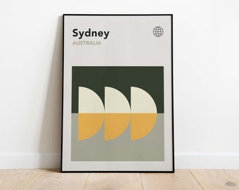 May include: A framed poster with a minimalist design featuring the word "Sydney" and the text "AUSTRALIA" in black text. The poster has a green background with three white and yellow semi-circles.