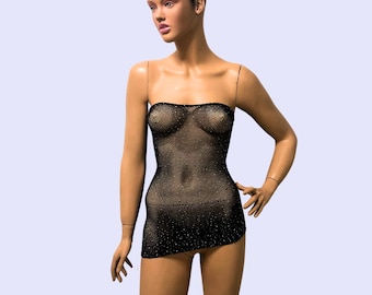 May include: A black mesh mini dress with a strapless neckline. The dress is made of a sheer fabric with a sparkly finish.
