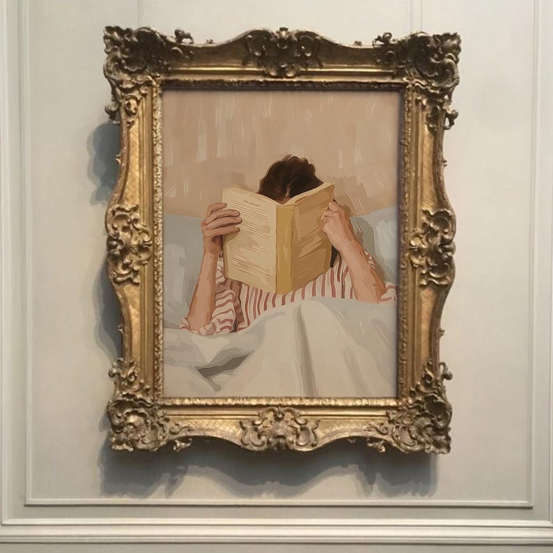 May include: A framed painting depicts a person reading in bed. The person is covered by a white blanket and wearing a red and white striped shirt. The painting is in an ornate gold frame.