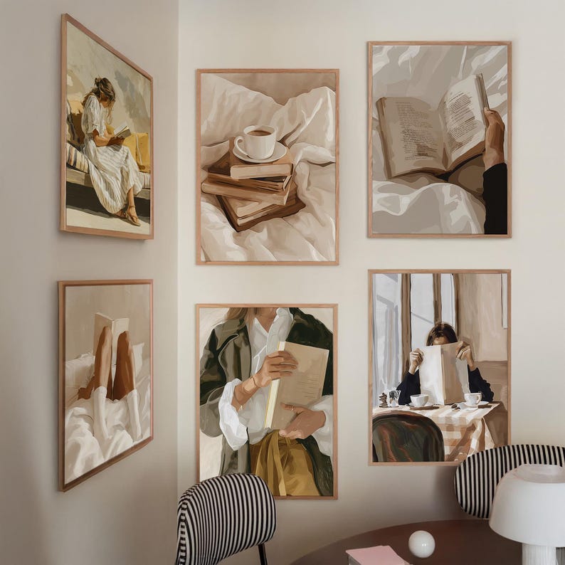 May include: A collection of framed art prints featuring scenes of people reading books. The artwork has a warm, neutral color palette with brown wooden frames. The images depict cozy settings with books, coffee cups, and soft bedding.