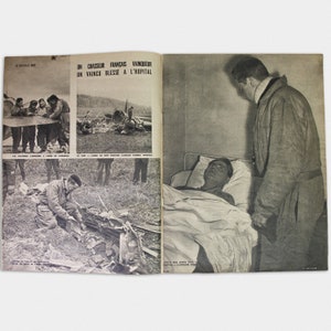Part of a vintage magazine with photographs and articles about the Second World War in French.