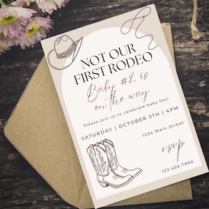 May include: A baby shower invitation with a cowboy theme. The invitation features a cowboy hat and boots illustration, with the text "NOT OUR FIRST RODEO" and "Baby #2 is on the way". The invitation includes event details.