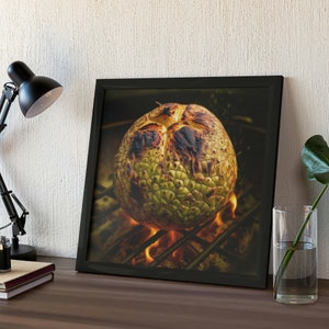 May include: A close-up of a whole jackfruit being grilled over an open fire. The jackfruit is charred on the outside and has a green and yellow color. The flames are visible beneath the jackfruit.