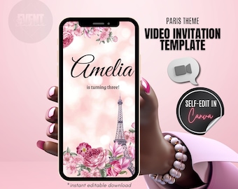 May include: A pink and white digital invitation template for a birthday party. The template features a floral design with the Eiffel Tower and the text "Amelia is turning three!"  The template is designed to be edited in Canva.