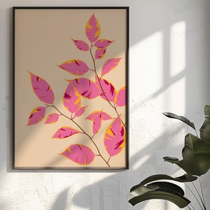 Puede incluir: Una impresión enmarcada de una rama de hojas estilizadas de color rosa y amarillo sobre un fondo beige.