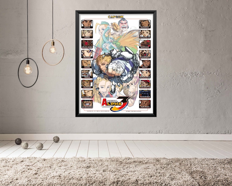 May include: A poster featuring the characters from the Street Fighter Alpha 3 video game. The poster is white with a black border and features the game's logo in the center. The characters are arranged in rows, with their names listed below each portrait.