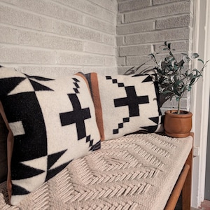 May include: A set of three ceramic mugs with a speckled, matte finish. The mugs are in shades of cream, light gray, and dark gray. Each mug has a simple, minimalist design, perfect for coffee or tea.