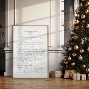 May include: A printable Christmas Story poster with a white background and black text. The text includes the Bible verse Luke 2:7-14, which tells the story of the birth of Jesus. The poster features a vintage style font and a decorative border.