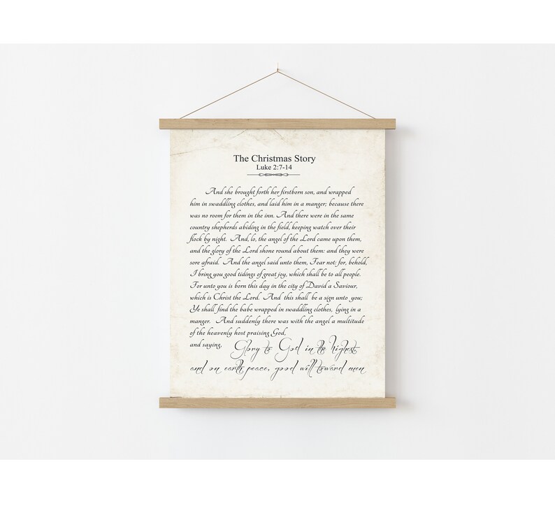 May include: A vintage-style print with a beige background and black text. The print features a passage from the Bible, Luke 2:7-14, telling the story of the birth of Jesus. The text reads "The Christmas Story" and "And she brought forth her firstborn son, and wrapped him in swaddling clothes, and laid him in a manger, because there was no room for them in the inn. And there were in the same country shepherds abiding in the field keeping watch over their flock by night. And, lo, the angel of the Lord came upon them, and the glory of the Lord shone round about them: and they were sore afraid. And the angel said unto them, Fear not: for, behold, I bring you good tidings of great joy, which shall be to all people. For unto you is born this day in the city of David a Saviour, which is Christ the Lord. And this shall be a sign unto you: Ye shall find the babe wrapped in swaddling clothes, lying in a manger. And suddenly there was with the angel a multitude of the heavenly host praising God, and saying, Glory to God in the highest, and on earth peace, good will toward men."