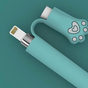 May include: A light blue phone charger with a paw print and heart design on the end. The charger is made of silicone and has a white connector.