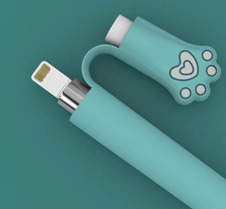 May include: A light blue phone charger with a paw print and heart design on the end. The charger is made of silicone and has a white connector.