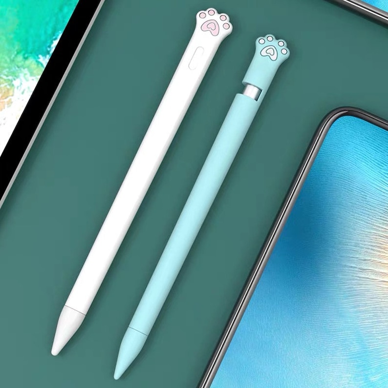 May include: Two stylus pens with paw print toppers. One pen is white with a pink paw print and the other is light blue with a light pink paw print.