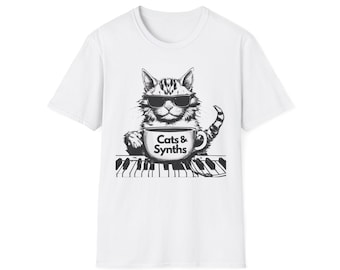 T-Shirt with Cat and Synth Design, Featuring 'Cats & Synths,' paired with a Mug of Coffee – Unique Cat Lover Apparel for Music Enthusiasts