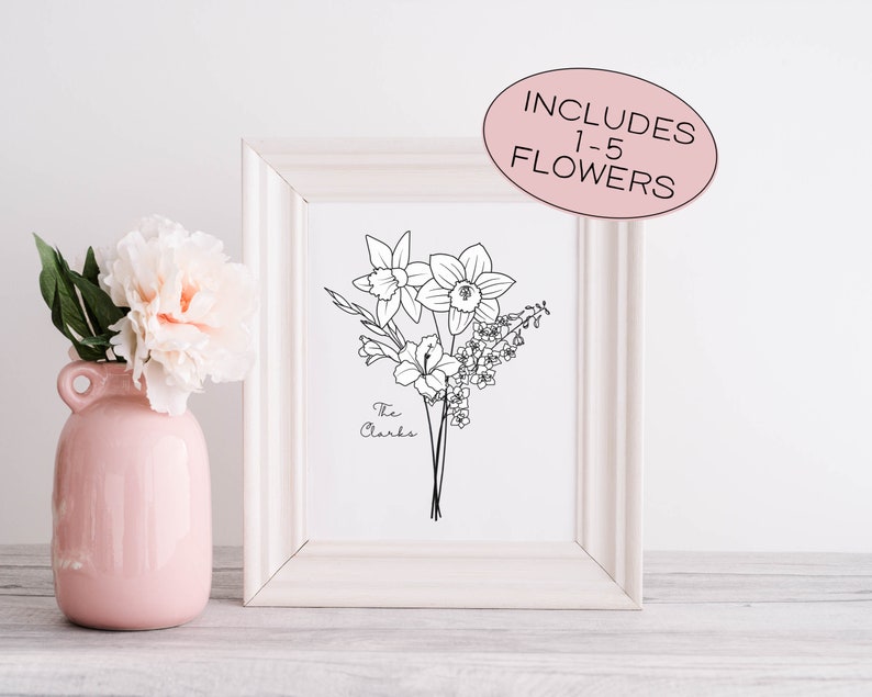 May include: A framed black and white floral line art print featuring daffodils, lilies, and other flowers. The print includes the text "The Clarks" and a pink oval sticker that reads "INCLUDES 1-5 FLOWERS". A pink vase with a peony is on the left.
