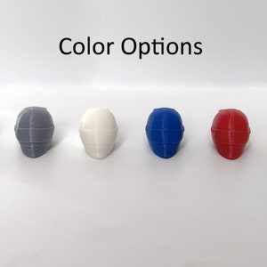 May include: Six miniature helmets in different colors: black, gray, white, blue, red, and yellow.  "Color Options" is written above the helmets.