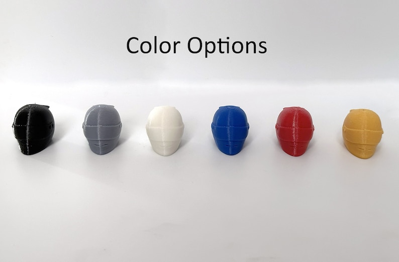 May include: Six miniature helmets in different colors: black, gray, white, blue, red, and yellow.  "Color Options" is written above the helmets.